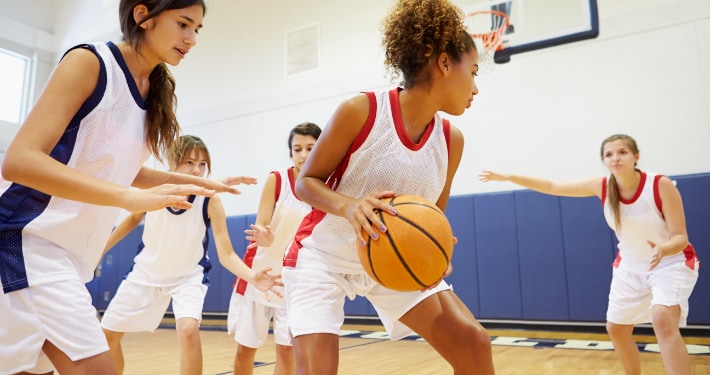 High school girls playing basketball