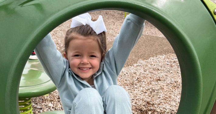 Smiling girl on a playground